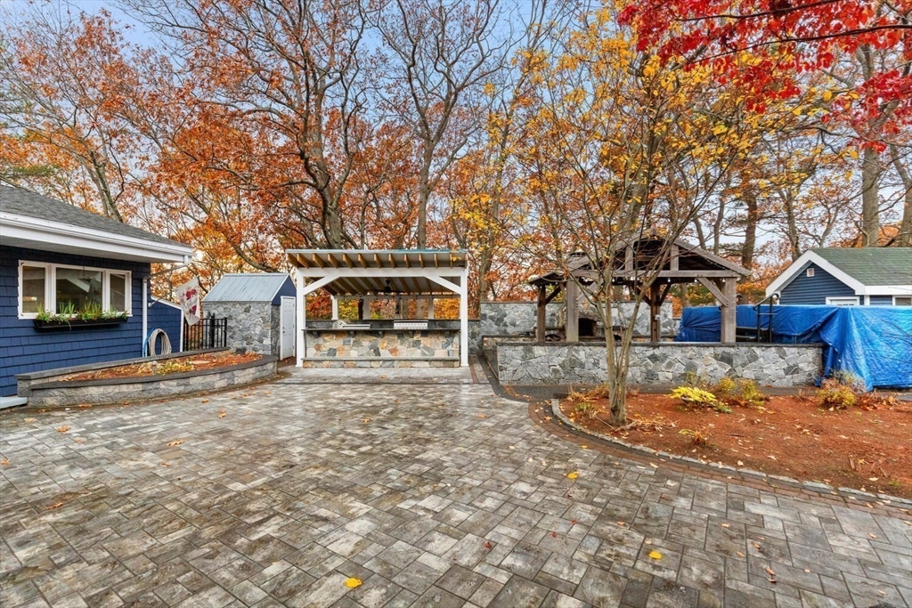 2 McIntyre Road Saugus, MA 01906 - Photo 3 of 42 a front view of a house with a yard covered with snow in front of house