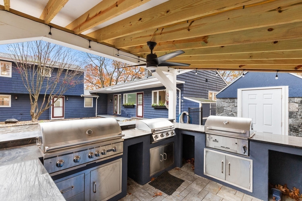 2 McIntyre Road Saugus, MA 01906 - Photo 36 of 42 a kitchen with stainless steel appliances granite countertop a stove and a refrigerator