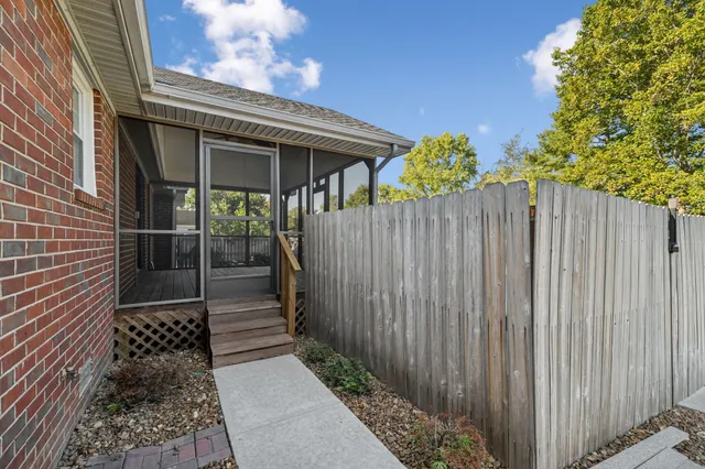 a view of a livingroom with furniture and a dishwasher