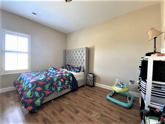 266 Owens Road Fort Mitchell, AL 36856 - Photo 12 of 16 a bedroom with bed and a window