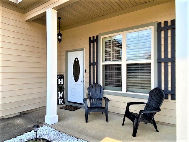 266 Owens Road Fort Mitchell, AL 36856 - Photo 3 of 16 a porch with a bench and a window