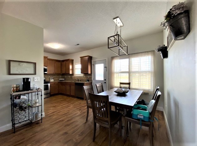 266 Owens Road Fort Mitchell, AL 36856 - Photo 5 of 16 a view of a dining room with furniture and wooden floor