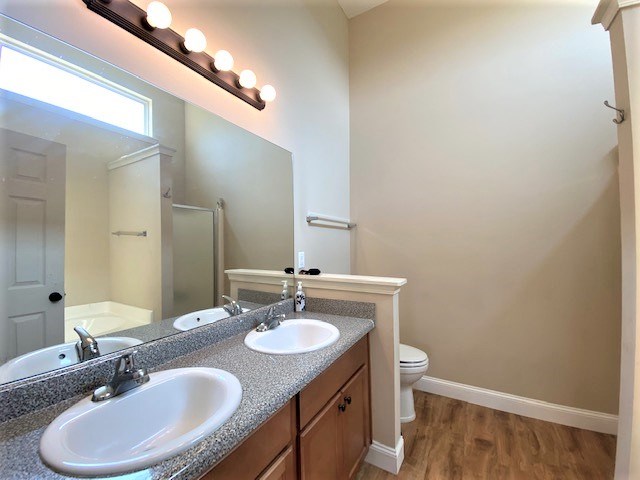 266 Owens Road Fort Mitchell, AL 36856 - Photo 8 of 16 a bathroom with a sink double vanity and a mirror