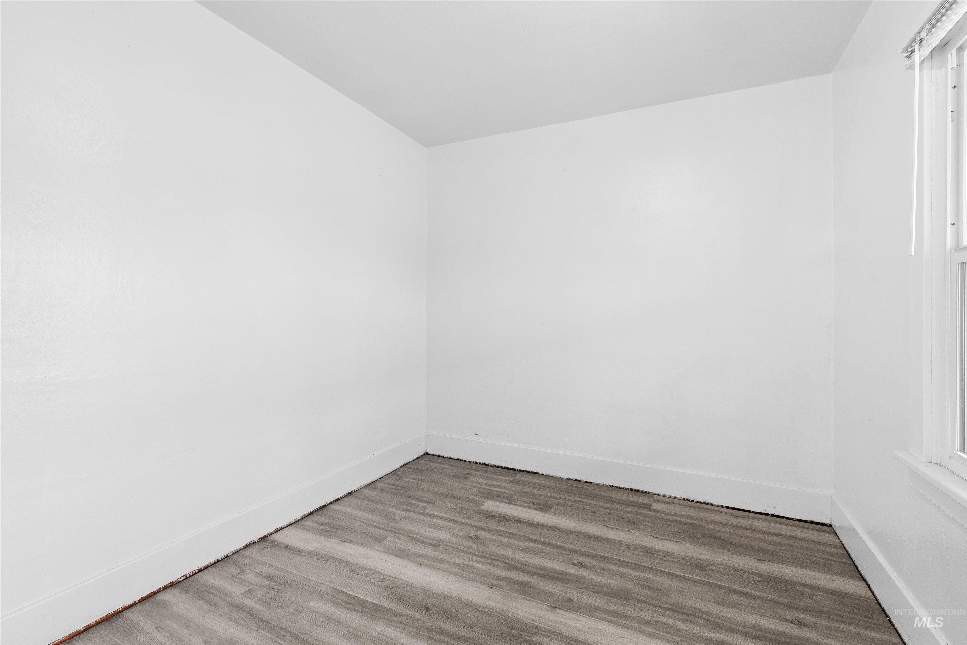 716 7th Street Clarkston, WA 99403 - Photo 14 of 38 Spare room with light wood-style flooring and baseboards