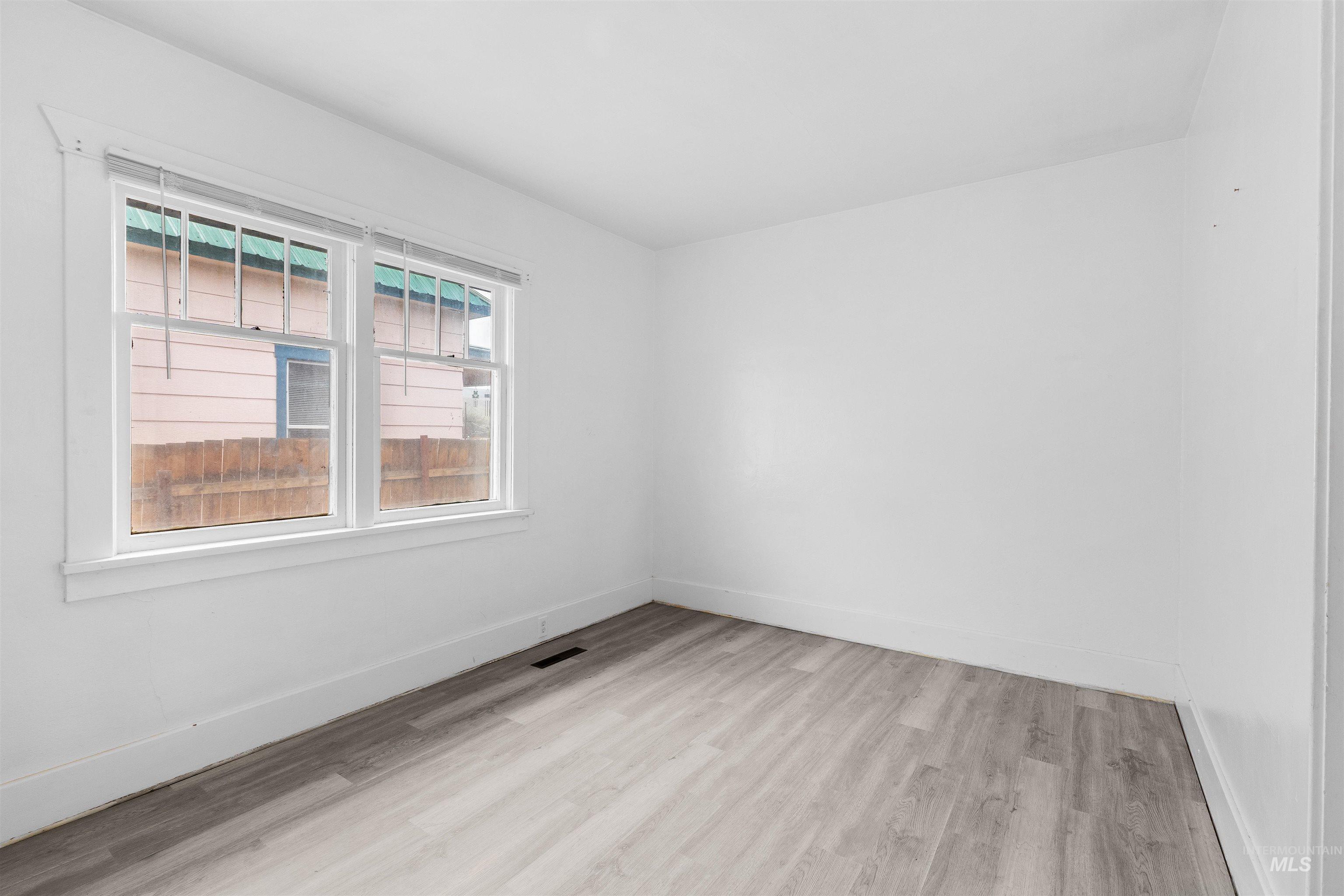 716 7th Street Clarkston, WA 99403 - Photo 16 of 38 Spare room with light wood-type flooring and baseboards