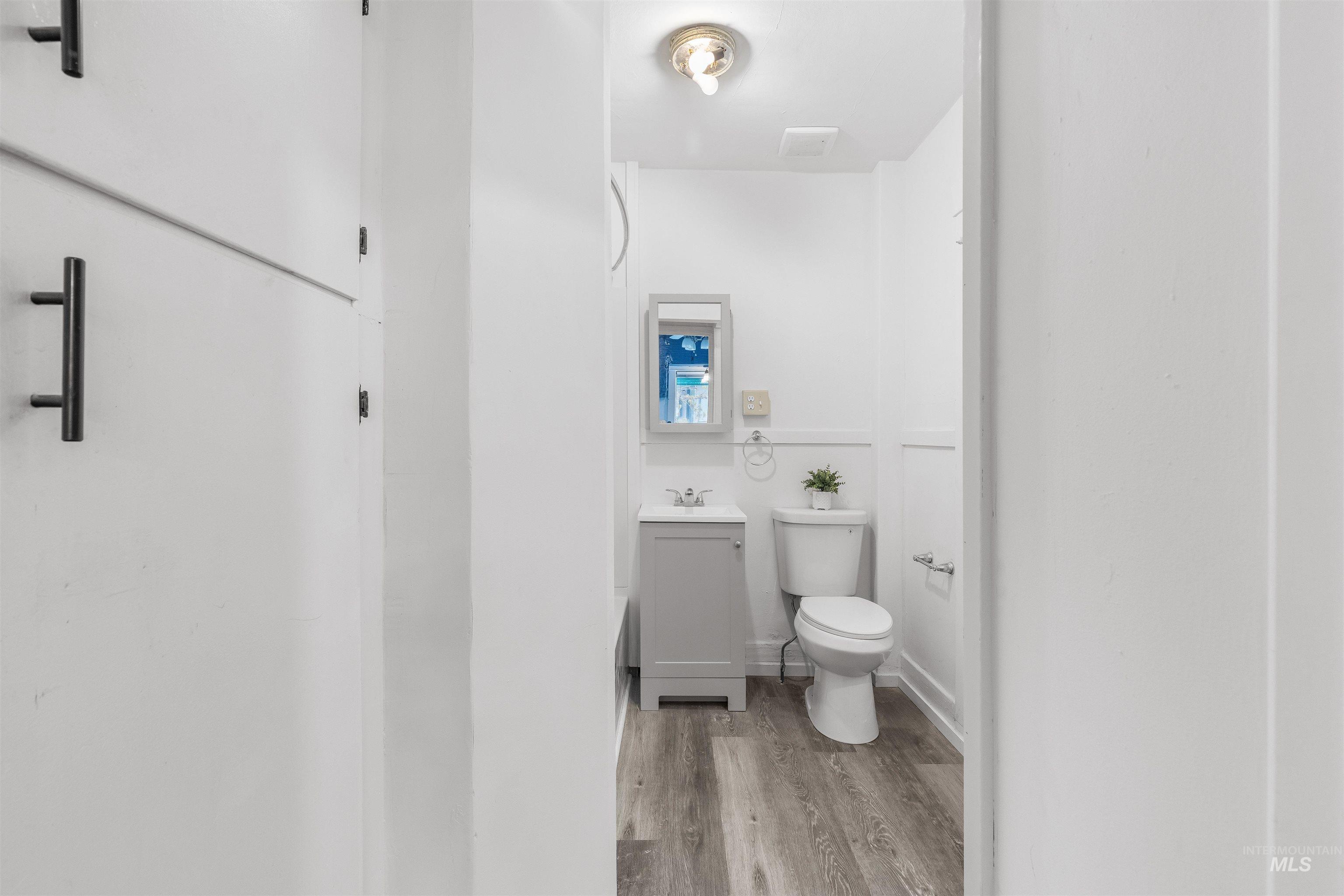 716 7th Street Clarkston, WA 99403 - Photo 20 of 38 Half bath featuring vanity and light wood finished floors