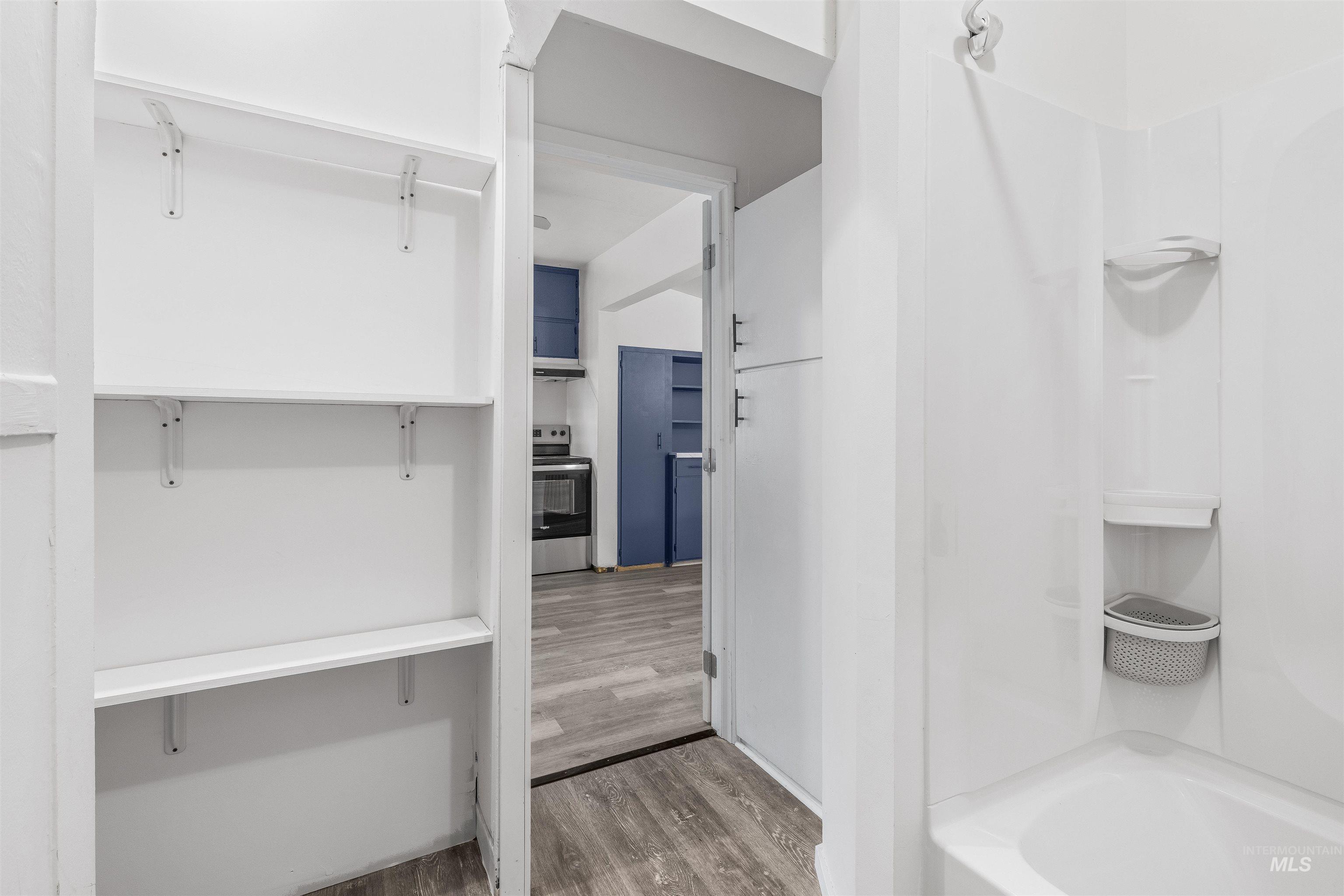 716 7th Street Clarkston, WA 99403 - Photo 22 of 38 Full bath featuring light wood-style floors and bathtub / shower combination