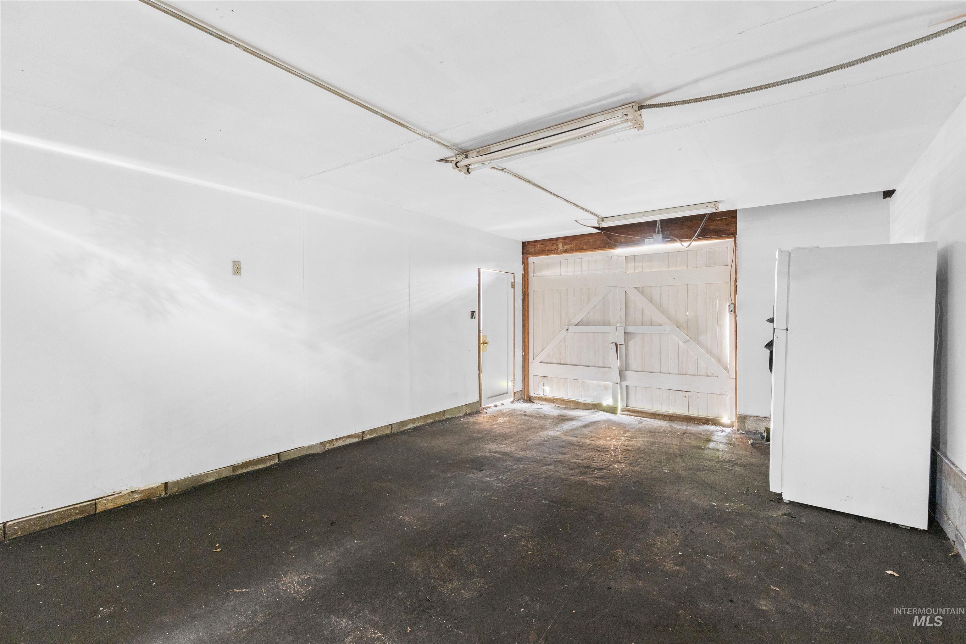 716 7th Street Clarkston, WA 99403 - Photo 37 of 38 Garage featuring freestanding refrigerator