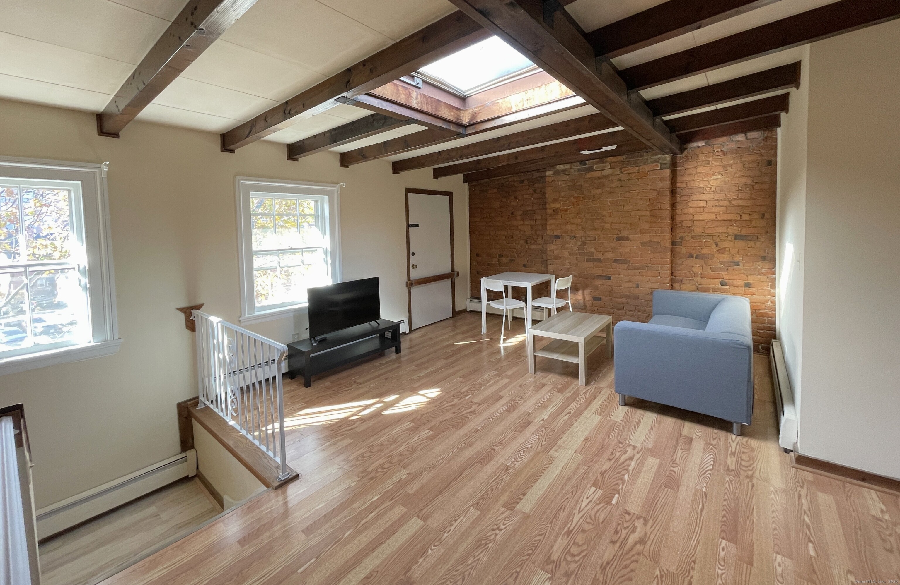 32 Trumbull Street, Unit 4 New Haven, CT 06511 - Photo 4 of 6 a living room with furniture and a wooden floor
