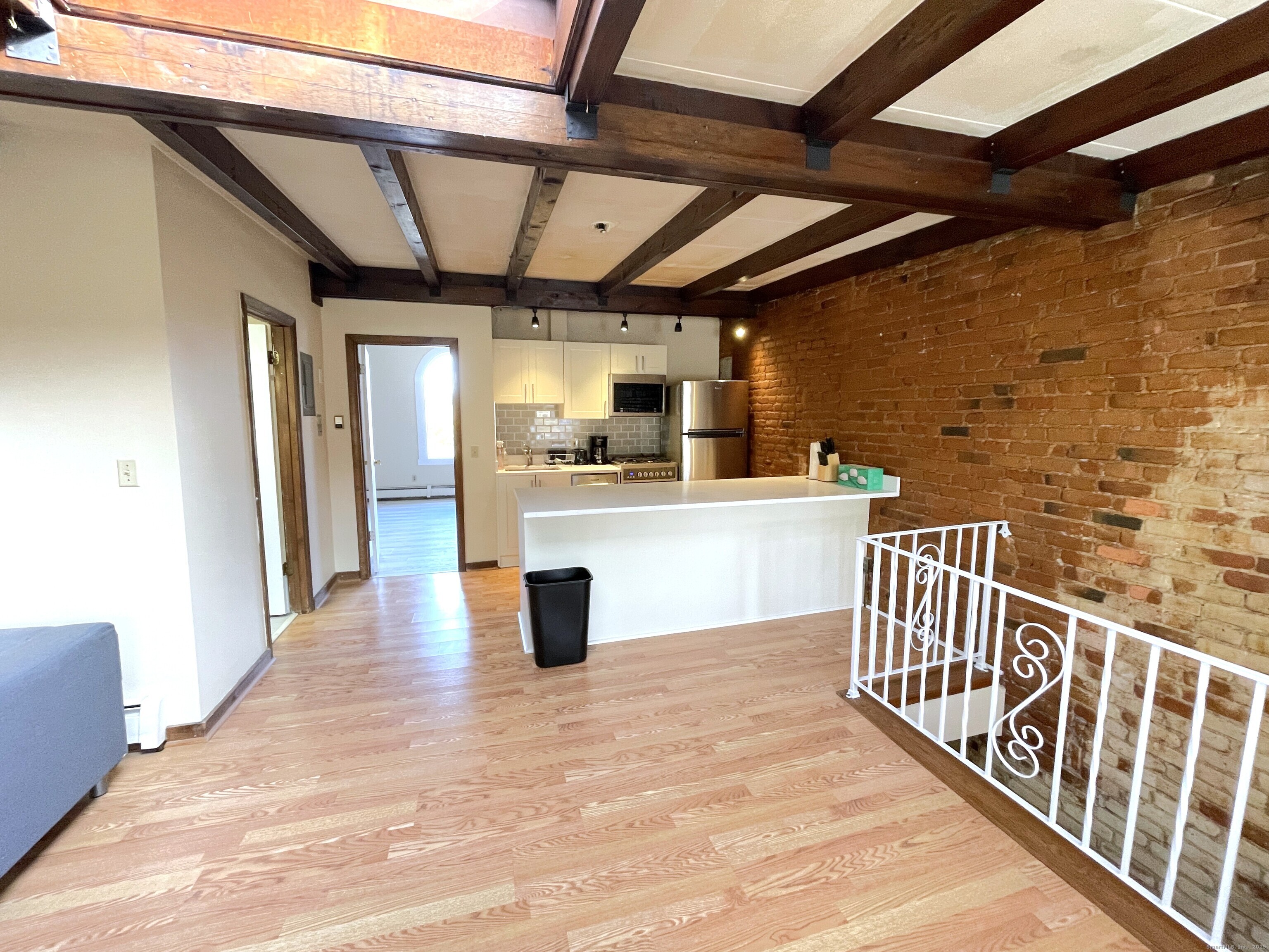 32 Trumbull Street, Unit 4 New Haven, CT 06511 - Photo 5 of 6 a view of a porch with wooden floor
