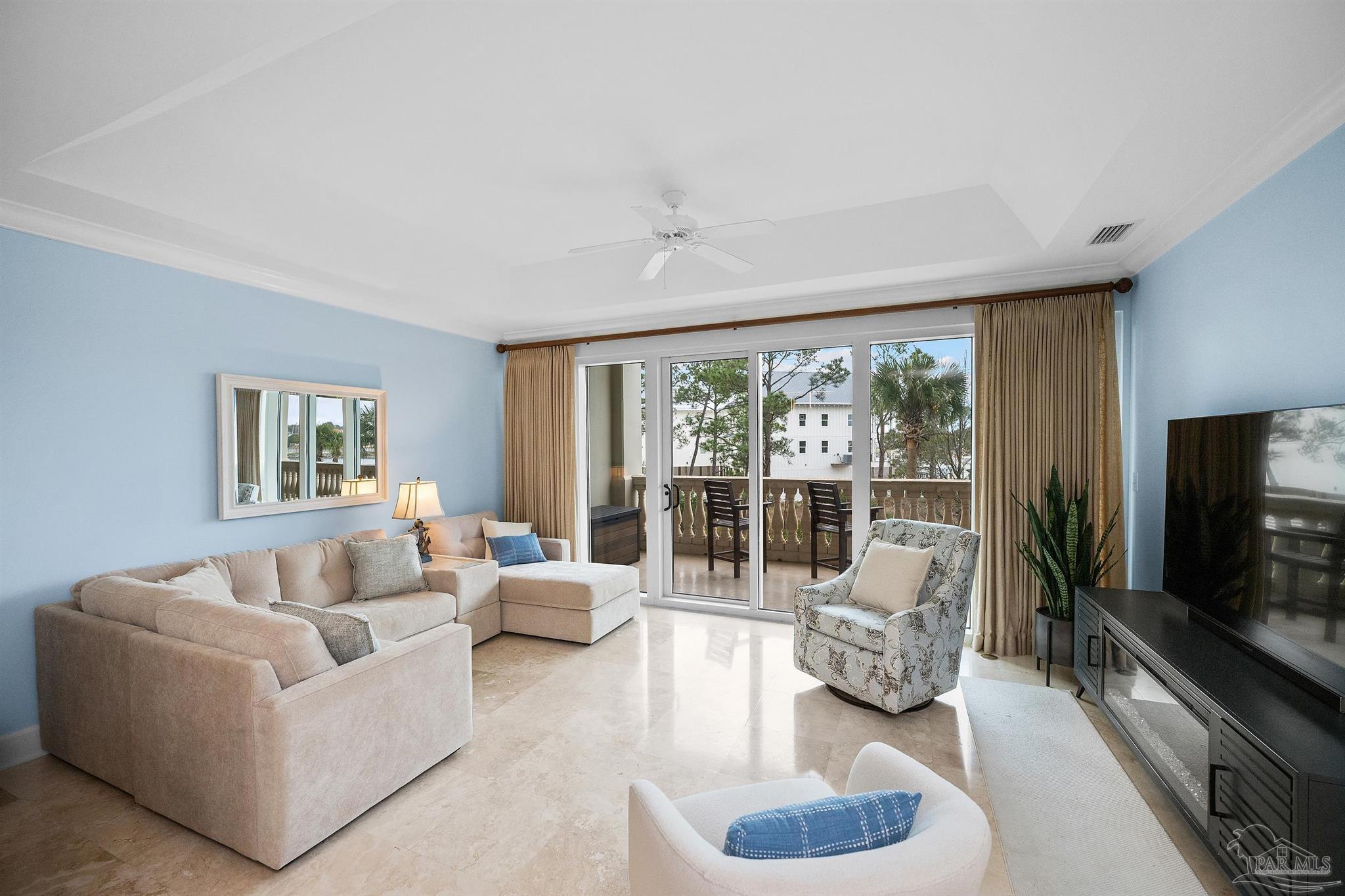 13928 River Road, Unit 204 Pensacola, FL 32507 - Photo 21 of 36 a living room with furniture and a flat screen tv