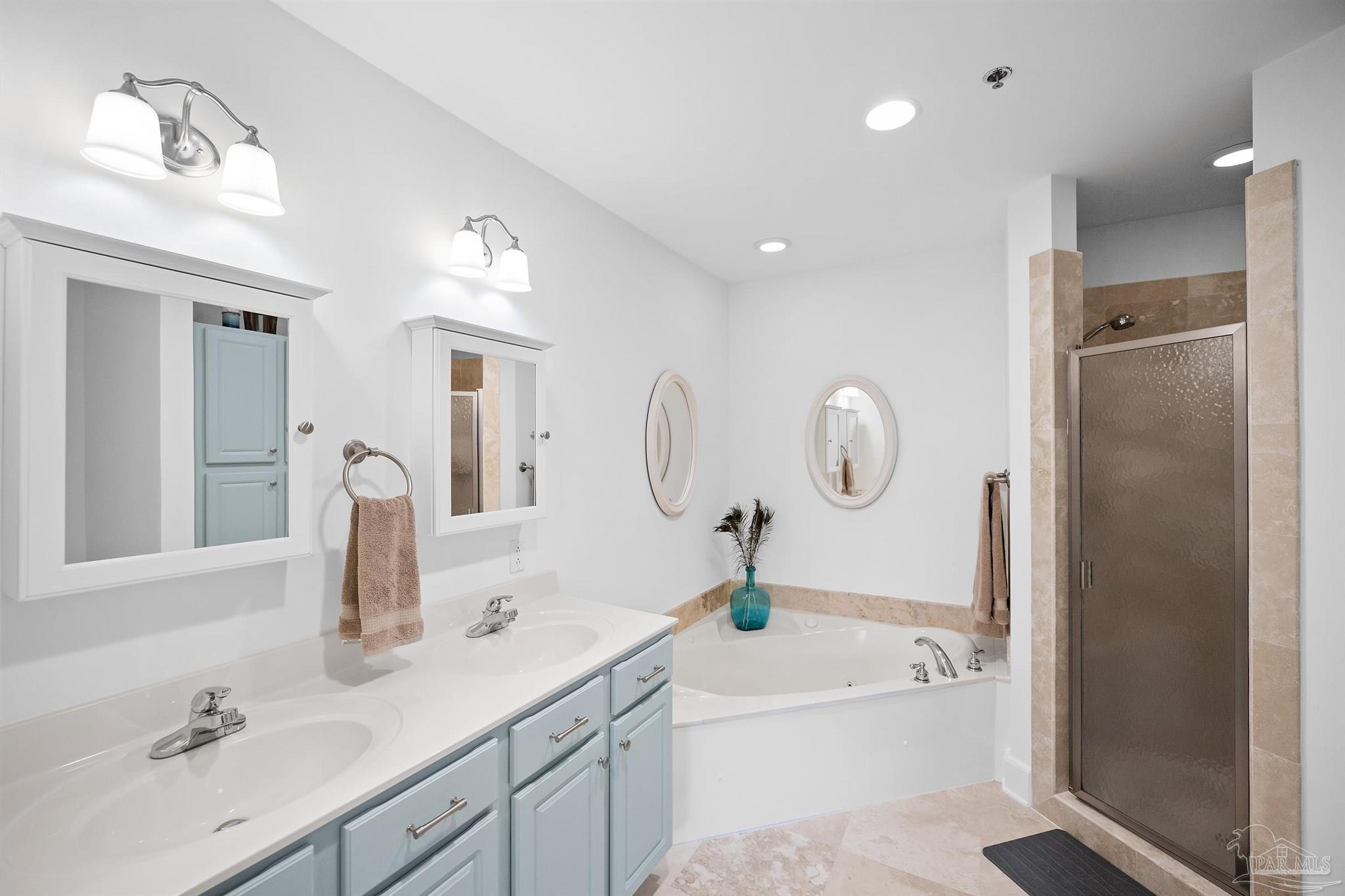 13928 River Road, Unit 204 Pensacola, FL 32507 - Photo 29 of 36 a bathroom with a double vanity sink mirror and shower