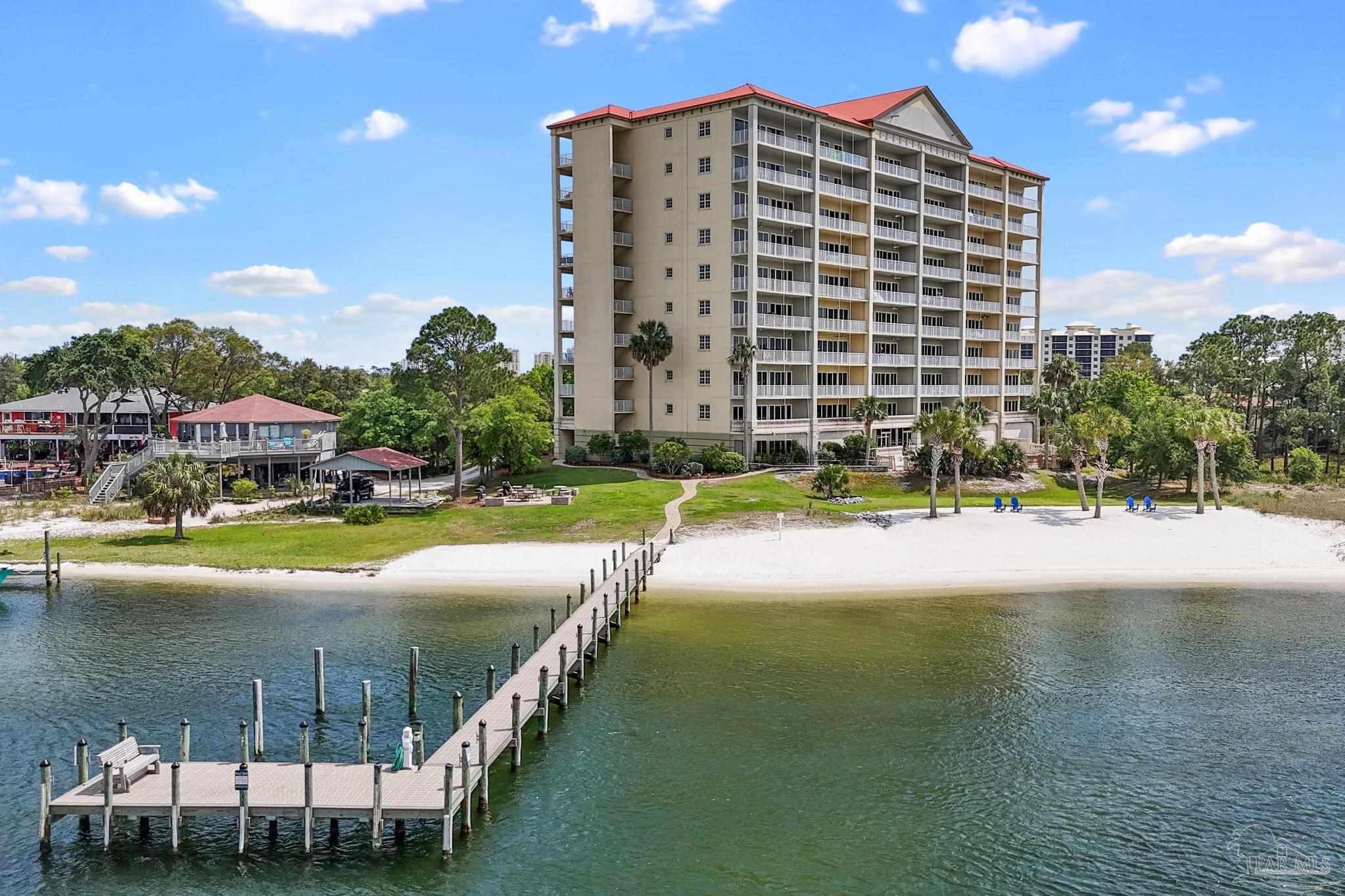 13928 River Road, Unit 204 Pensacola, FL 32507 - Photo 5 of 36 a view of a swimming pool with outdoor seating
