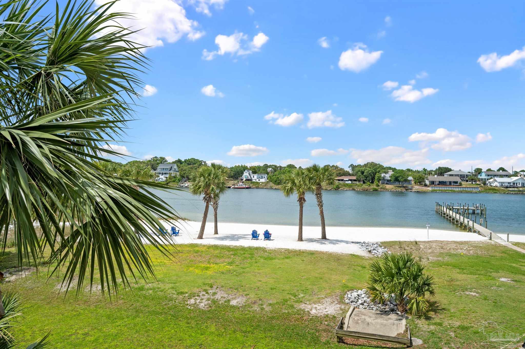13928 River Road, Unit 204 Pensacola, FL 32507 - Photo 7 of 36 a view of a lake from a yard