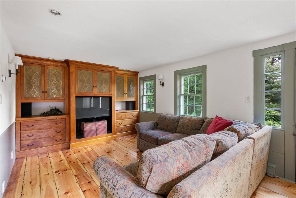 61 Dutton Road Sudbury, MA 01776 - Photo 11 of 42 a living room with furniture and a flat screen tv