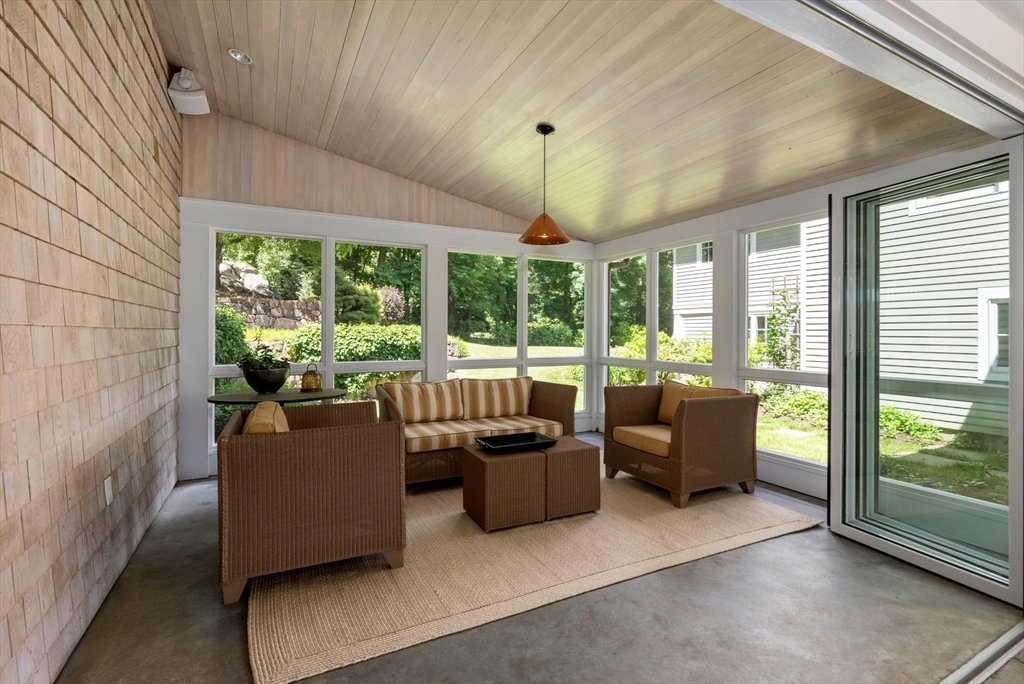 61 Dutton Road Sudbury, MA 01776 - Photo 27 of 42 a living room with furniture and a floor to ceiling window