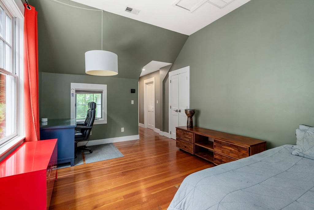 61 Dutton Road Sudbury, MA 01776 - Photo 34 of 42 a bedroom with two beds and wooden floor