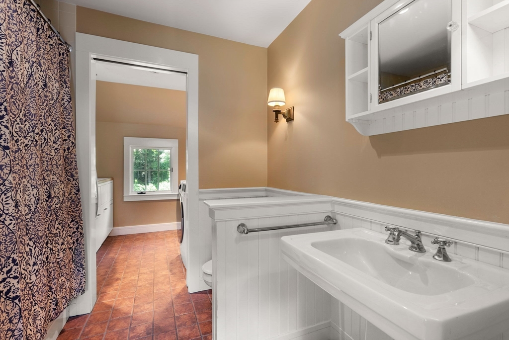61 Dutton Road Sudbury, MA 01776 - Photo 35 of 42 a bathroom with a sink and a mirror