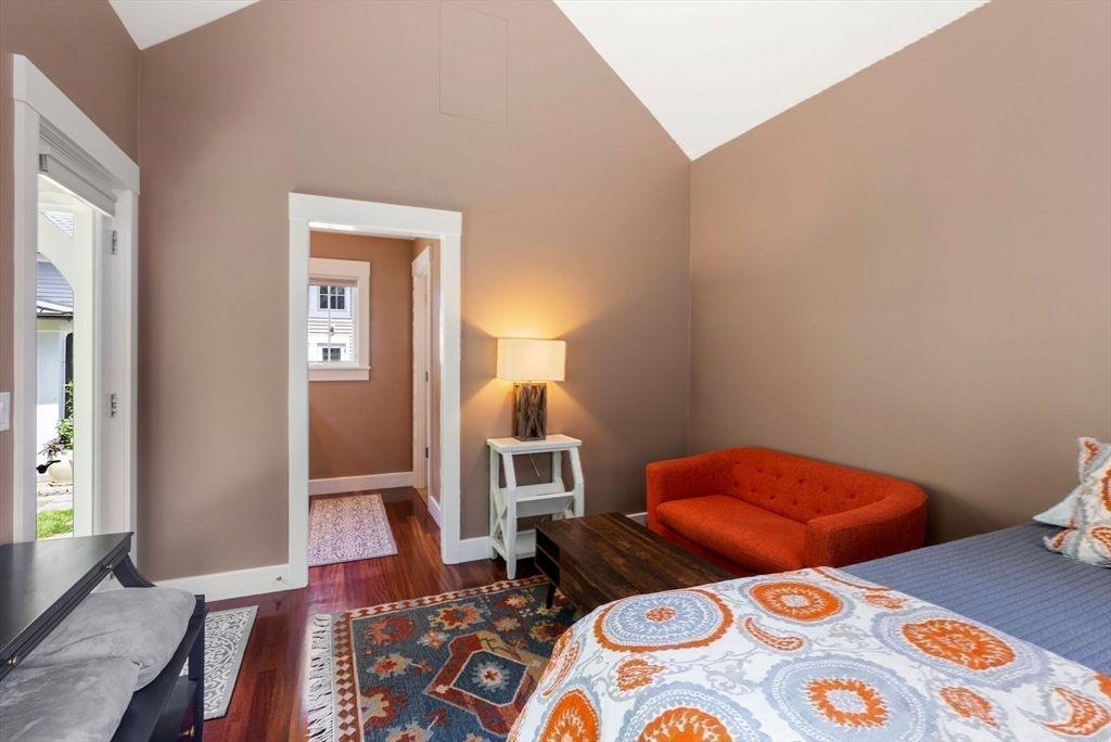61 Dutton Road Sudbury, MA 01776 - Photo 38 of 42 a bedroom with two beds and wooden floor