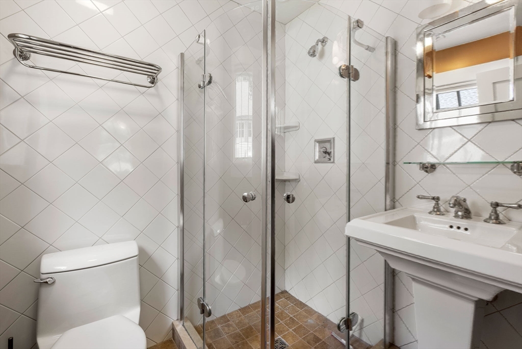 61 Dutton Road Sudbury, MA 01776 - Photo 39 of 42 a bathroom with a sink toilet and shower