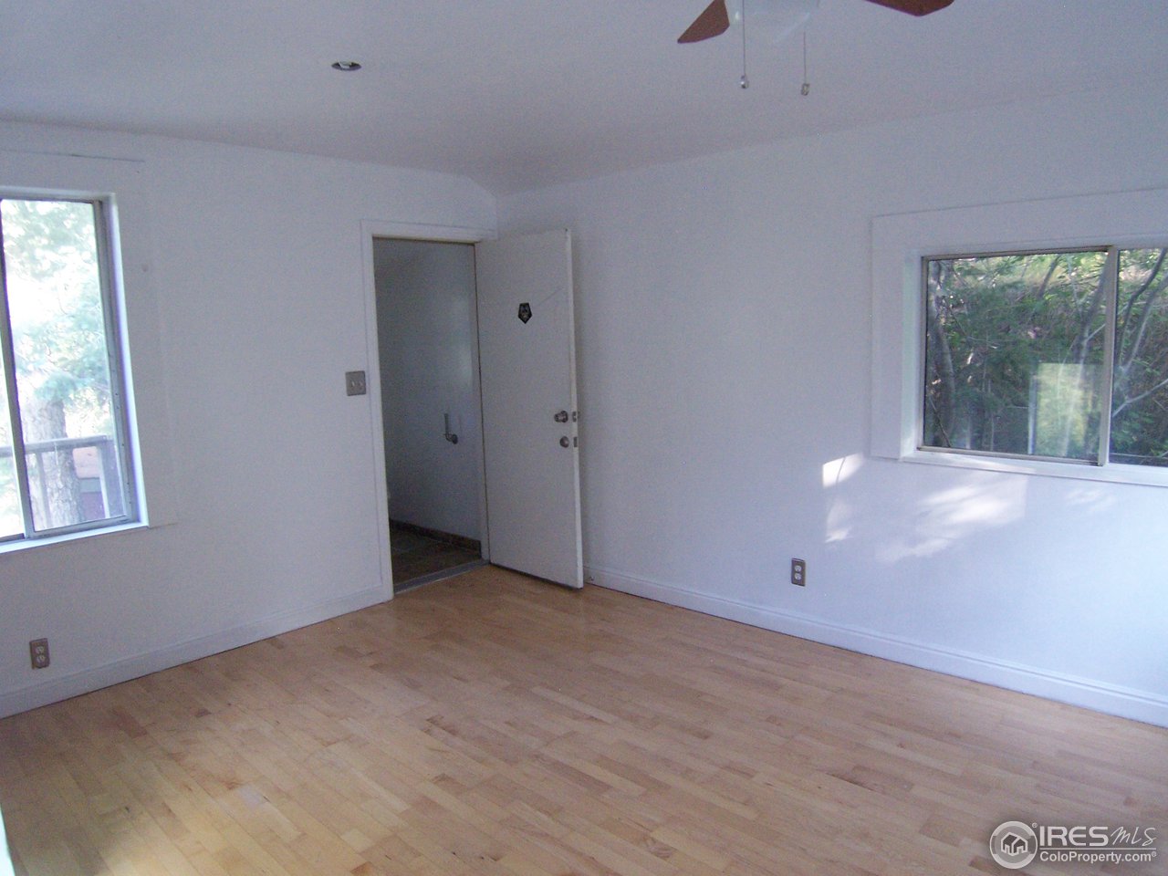 77 Alpine Gulch Road Boulder, CO 80302 - Photo 8 of 18 a view of an empty room with a window
