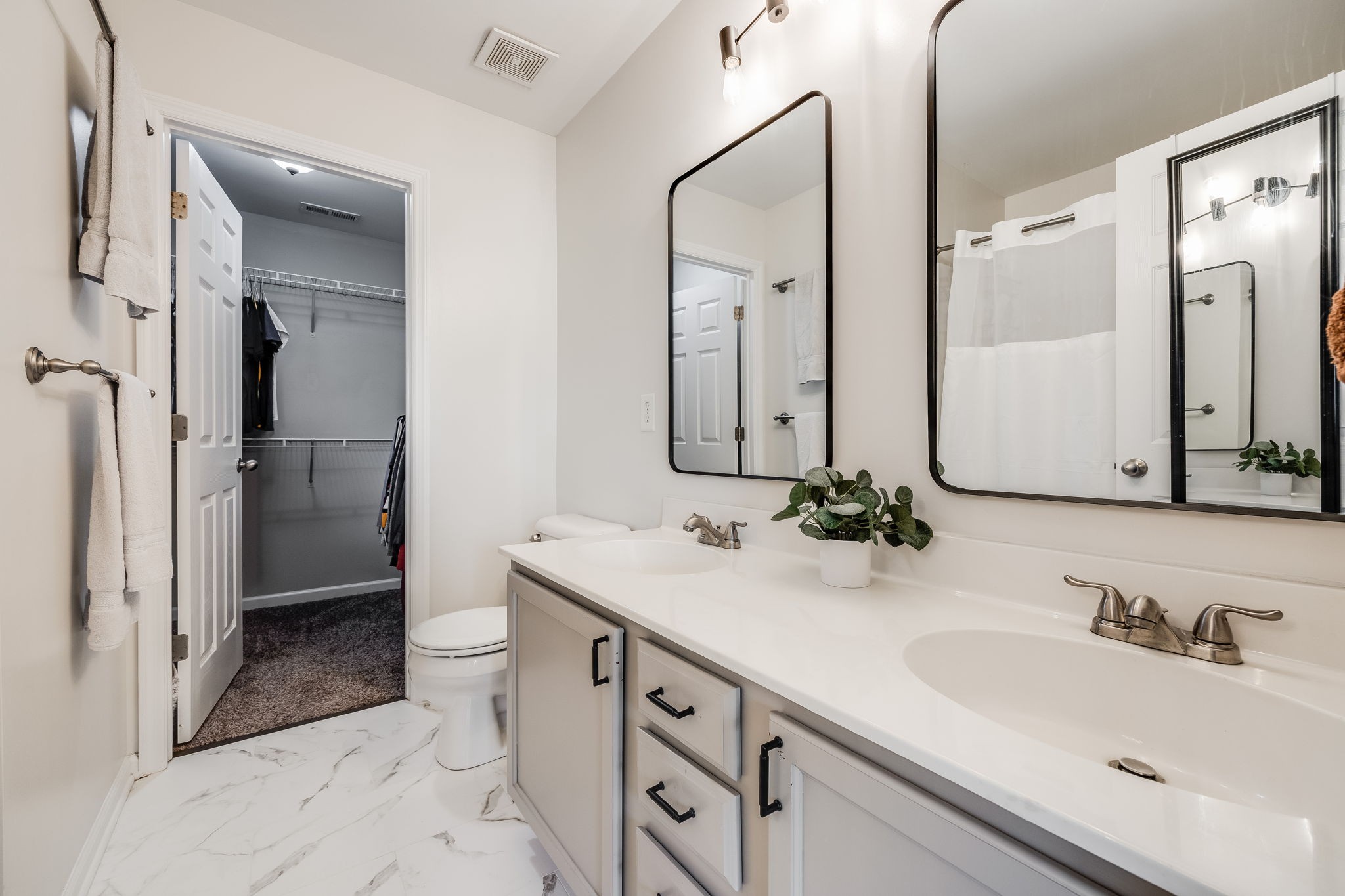 1382 Rural Hill Road, Unit 329 Antioch, TN 37013 - Photo 17 of 30 Upgraded primary bathroom with double vanities, fresh tile, lighting, and mirrors.