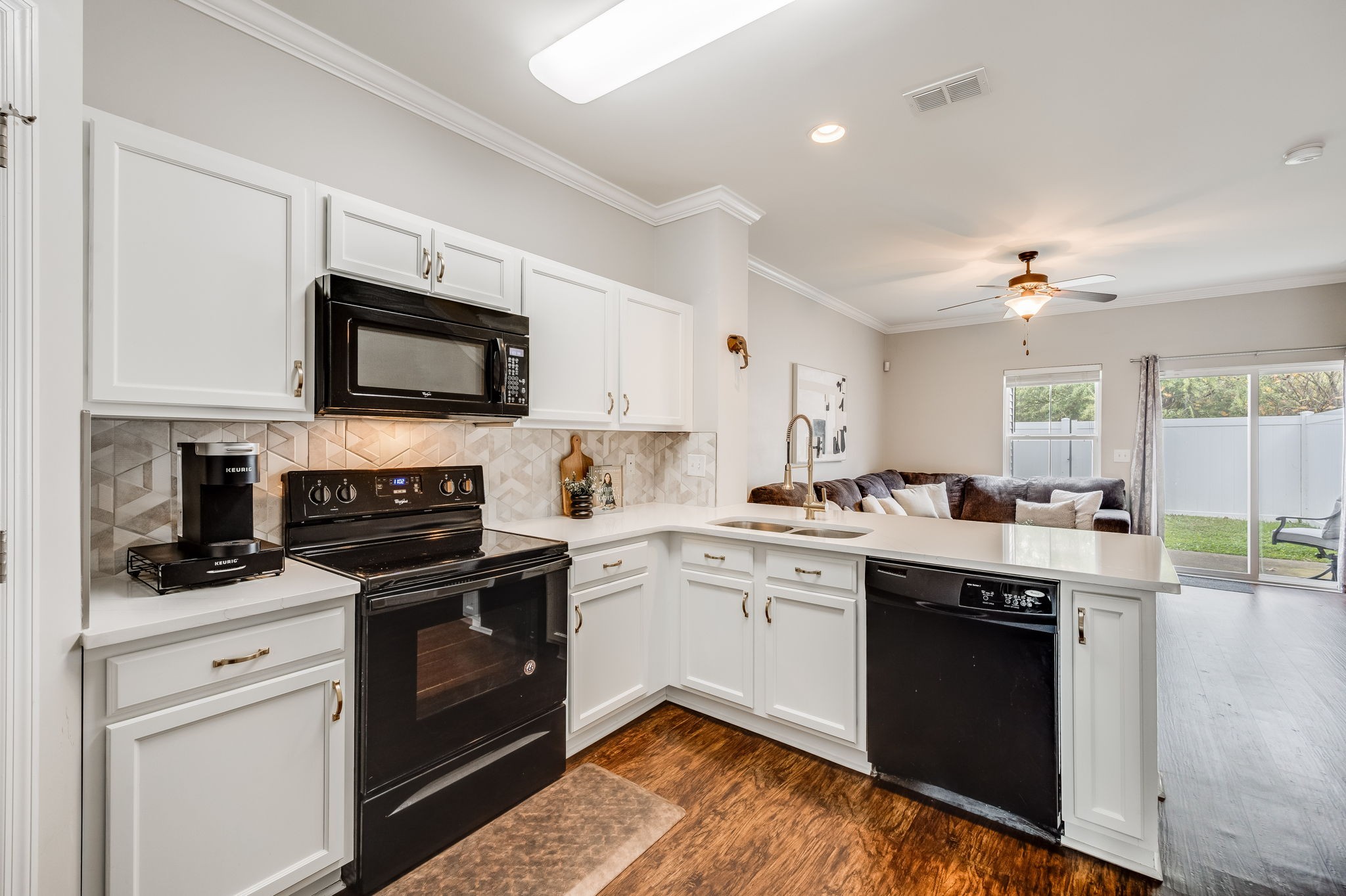 1382 Rural Hill Road, Unit 329 Antioch, TN 37013 - Photo 4 of 30 Upgraded kitchen with quartz countertops, decorative backsplash and painted cabinets.