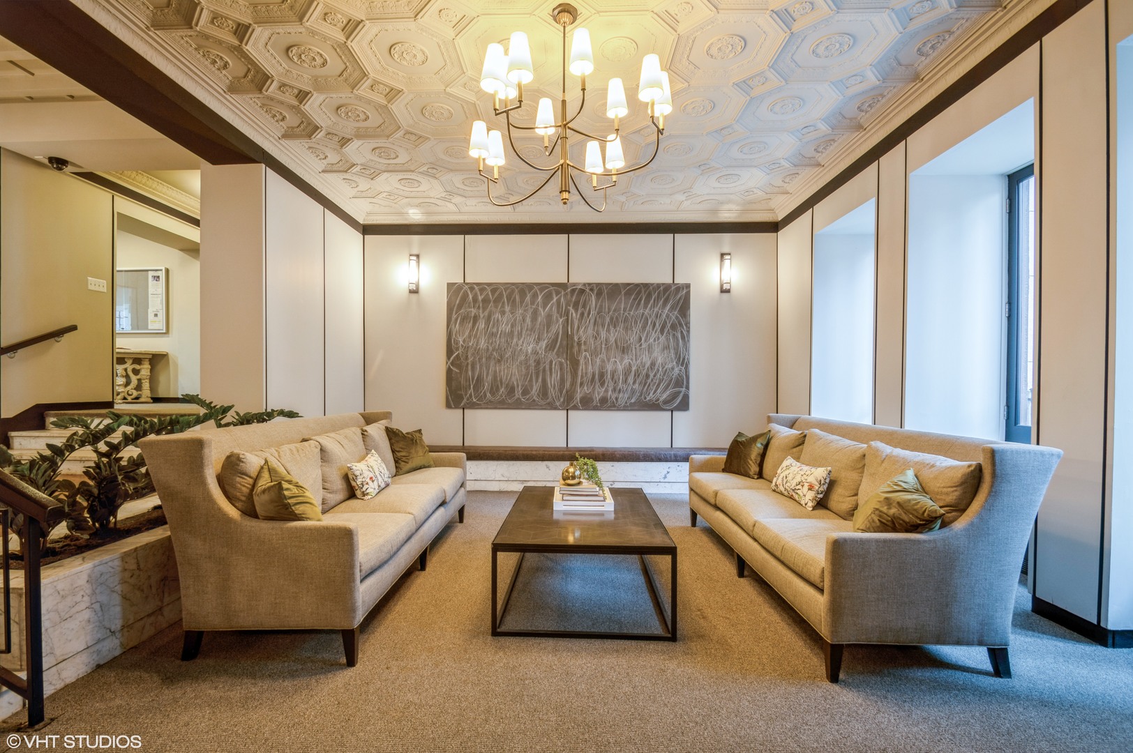 6101 North Sheridan Road, Unit 8B Chicago, IL 60660 - Photo 3 of 9 a living room with furniture and a chandelier
