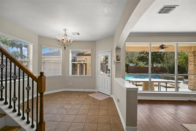 a view of a room with wooden floor and outdoor space