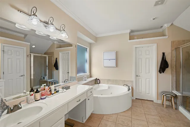 a bathroom with a bathtub sink and mirror