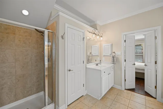 a view of a bathroom with a shower and a sink