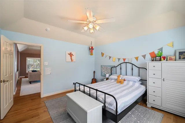 a bedroom with furniture and a chandelier