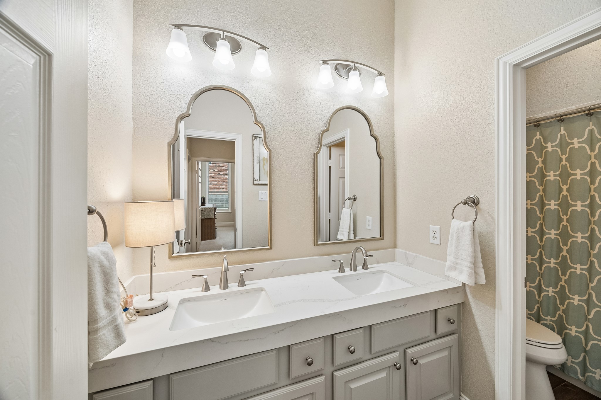 12523 Cedar Key Trail Humble, TX 77346 - Photo 20 of 33 a bathroom with a double vanity sink and a mirror