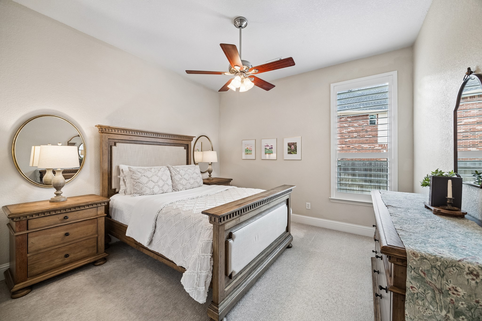 12523 Cedar Key Trail Humble, TX 77346 - Photo 21 of 33 a bedroom with a bed a dresser and a chandelier