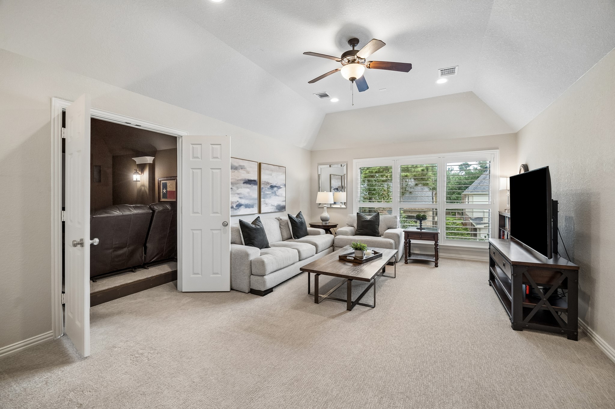 12523 Cedar Key Trail Humble, TX 77346 - Photo 22 of 33 a living room with furniture and a flat screen tv