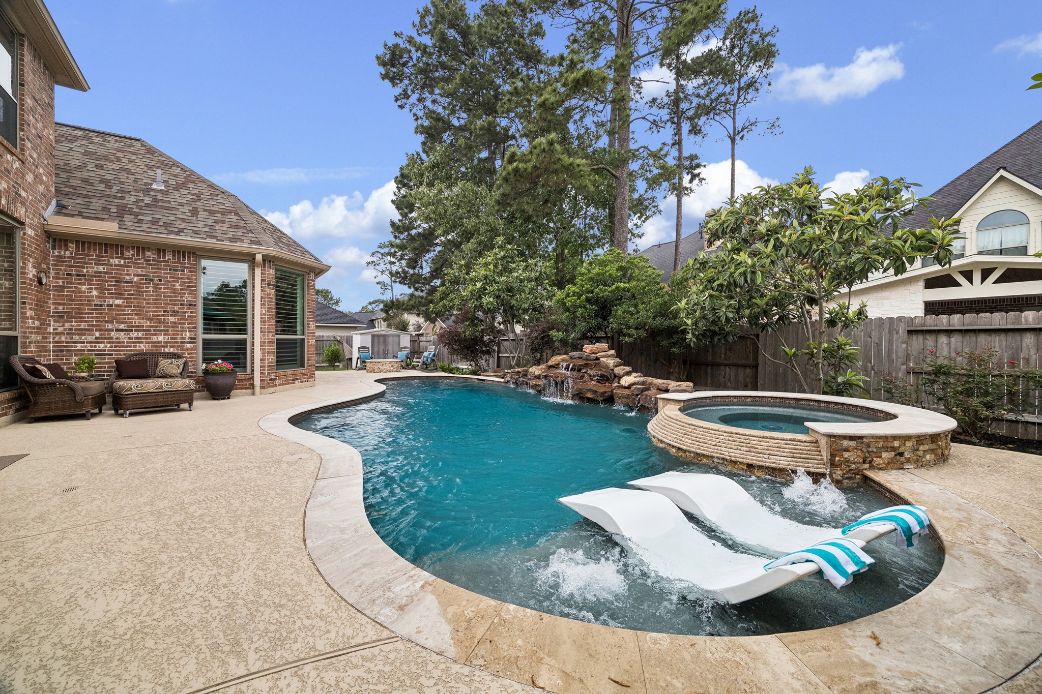 12523 Cedar Key Trail Humble, TX 77346 - Photo 28 of 33 a view of a backyard with furniture and a fire pit