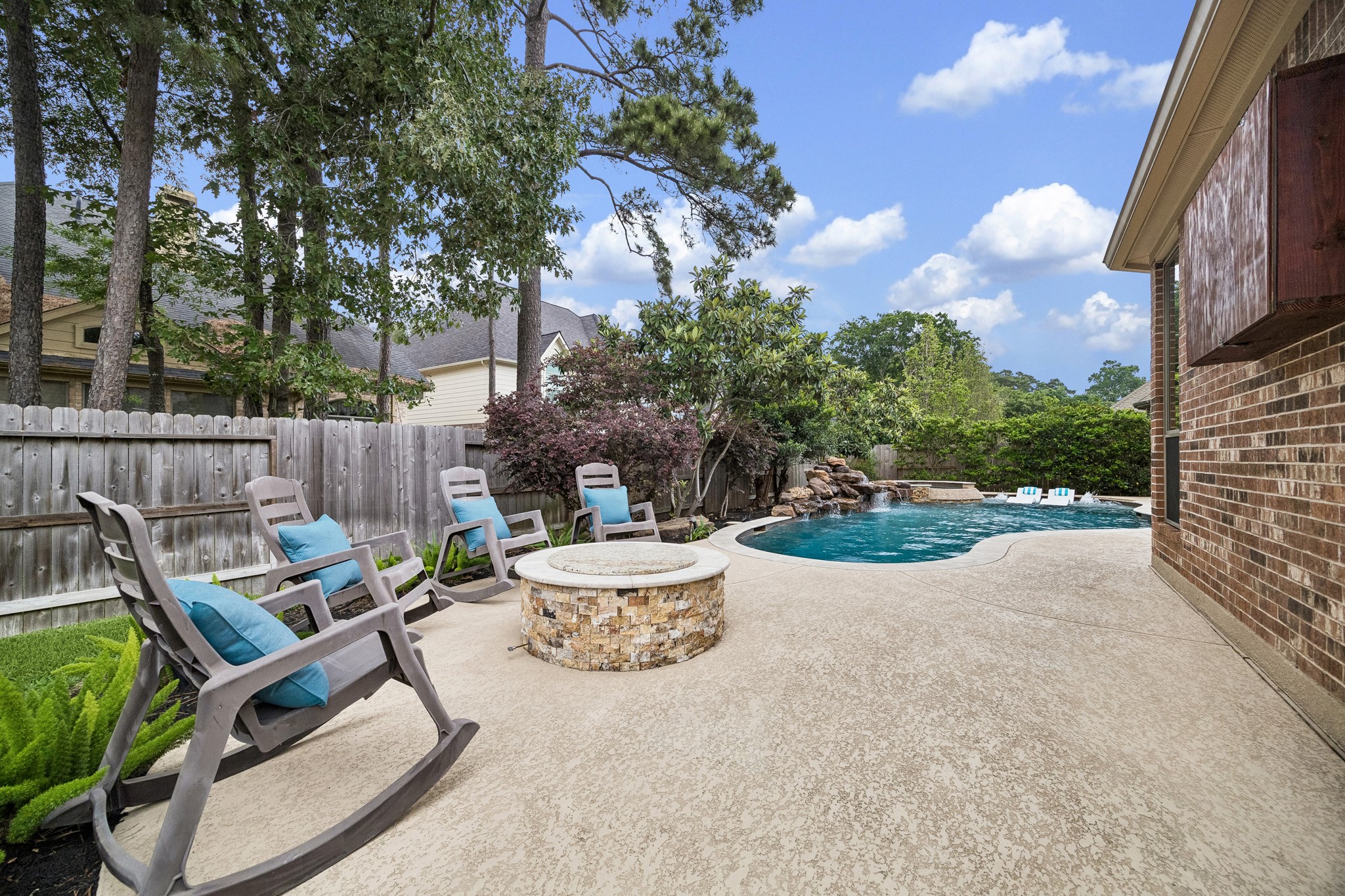 12523 Cedar Key Trail Humble, TX 77346 - Photo 30 of 33 a backyard of a house with table and chairs plants and large tree