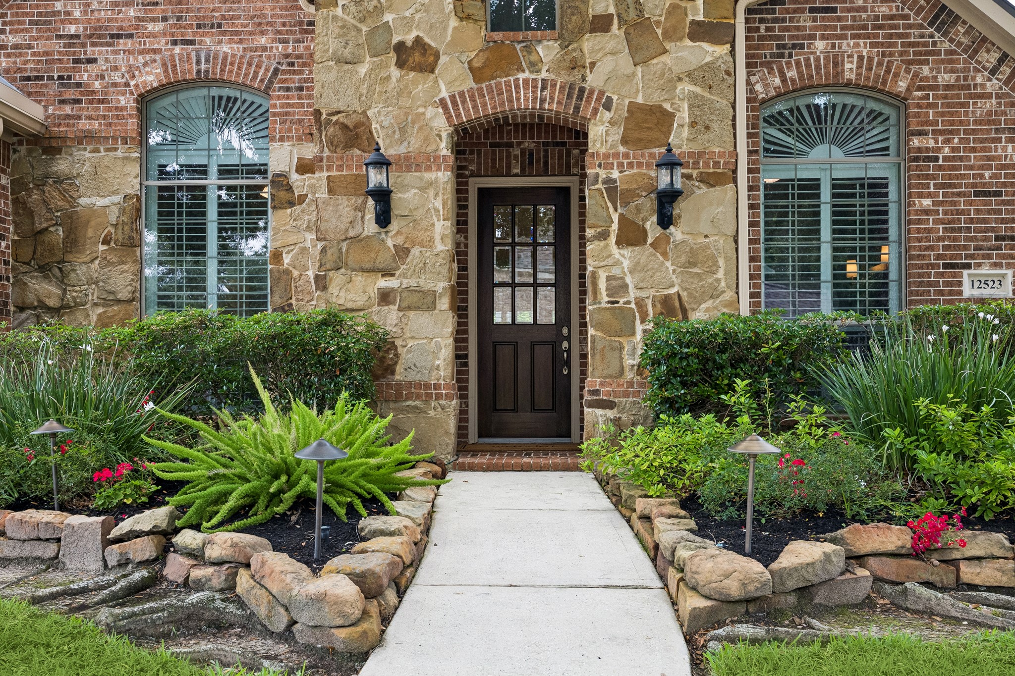 12523 Cedar Key Trail Humble, TX 77346 - Photo 3 of 33 a potted plant sitting in front of a building
