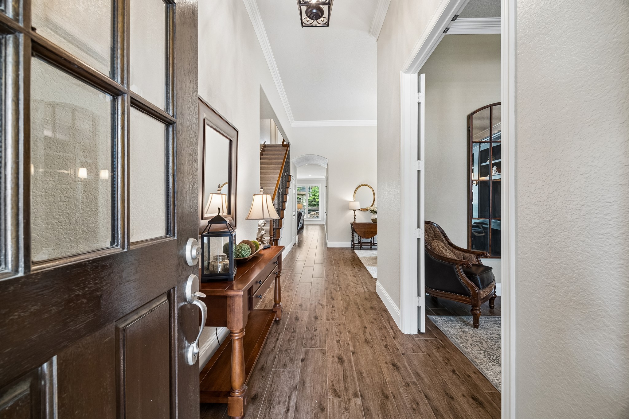 12523 Cedar Key Trail Humble, TX 77346 - Photo 4 of 33 wooden floor in a hall with a large window and wooden floor