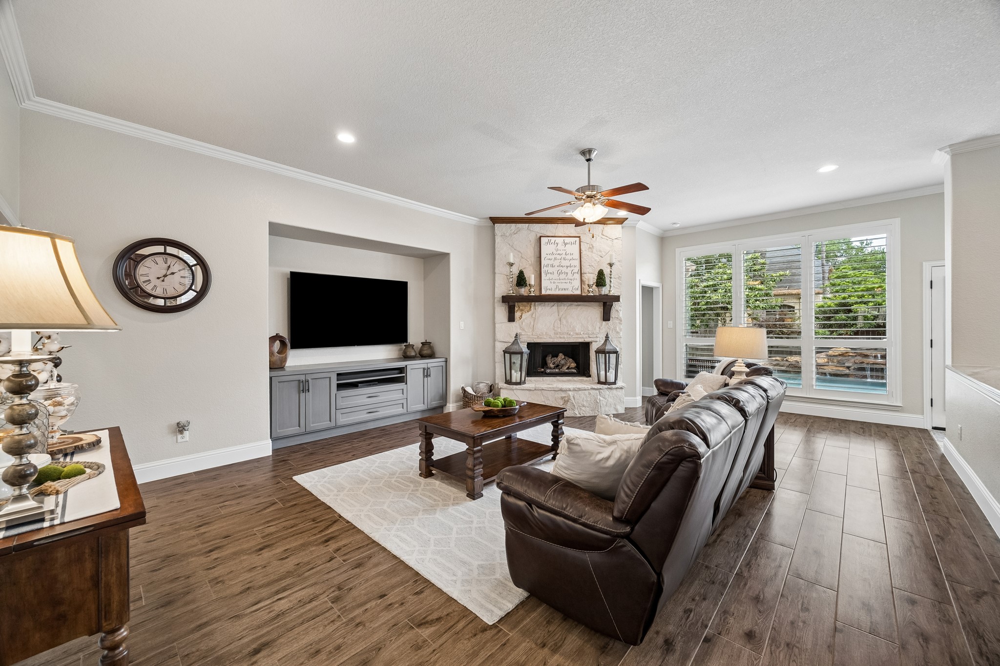 12523 Cedar Key Trail Humble, TX 77346 - Photo 7 of 33 a living room with furniture a flat screen tv and a fireplace