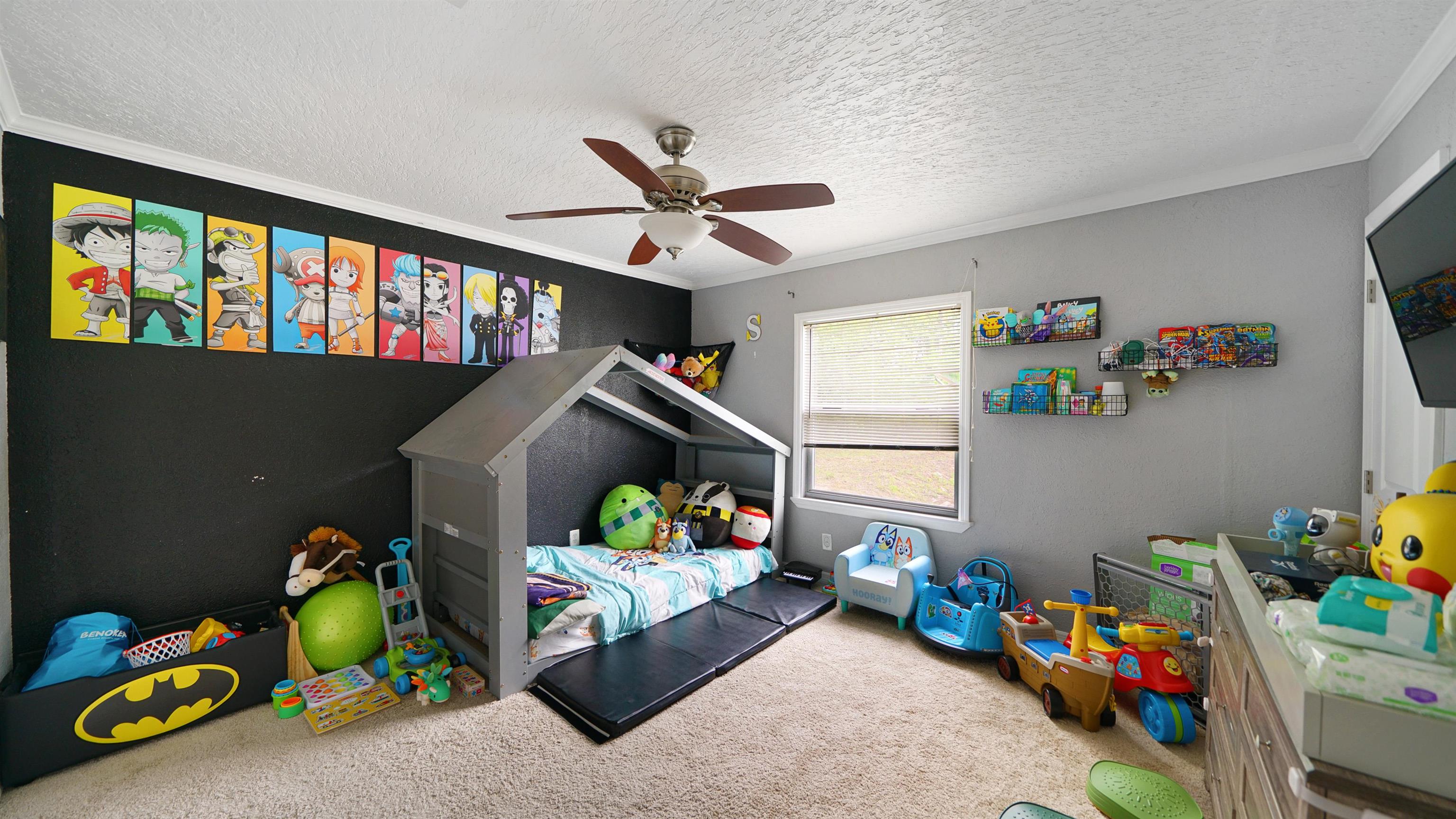 117 Jack Road Palatka, FL 32177 - Photo 18 of 34 a children room with toys and a couch