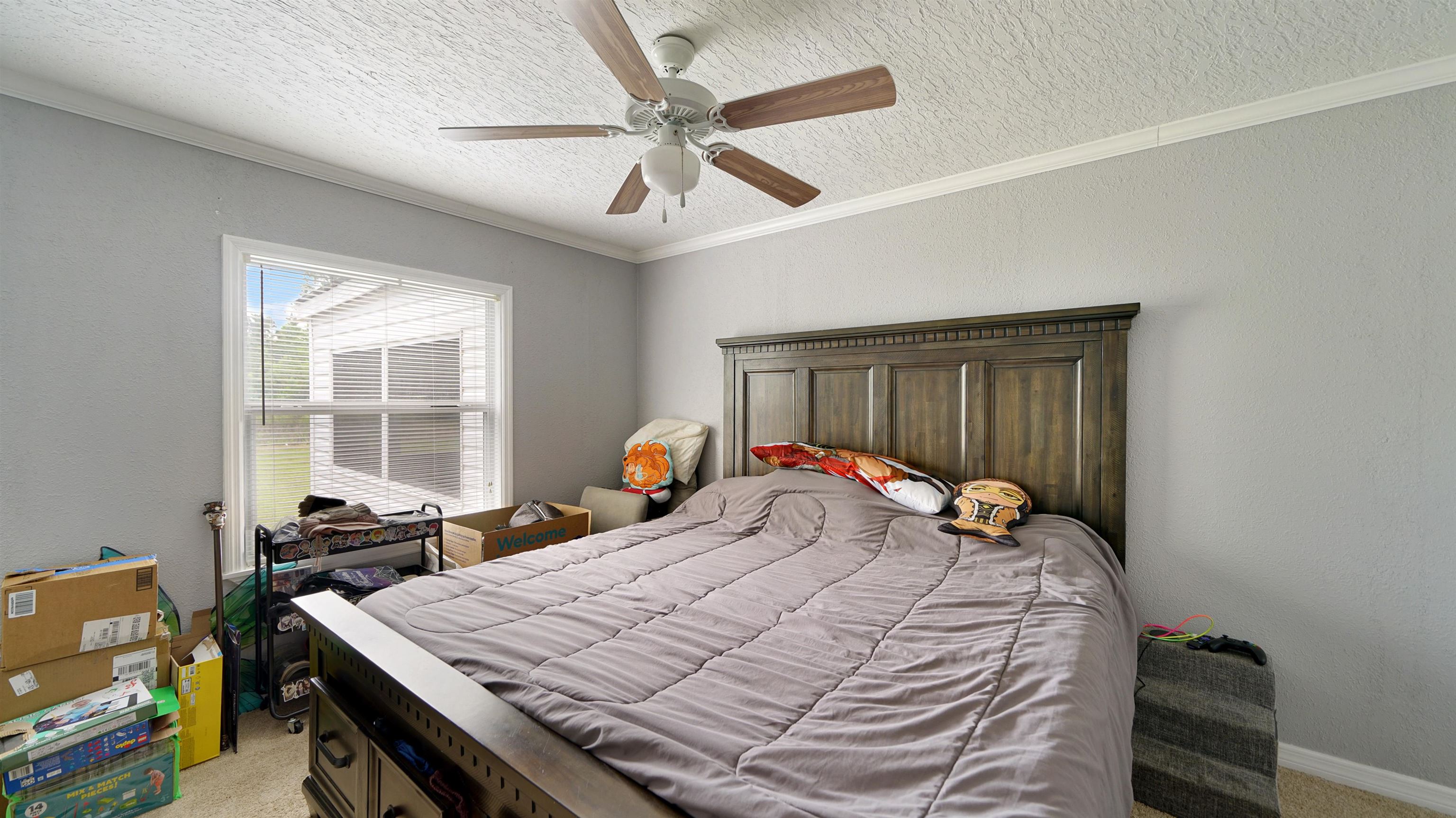 117 Jack Road Palatka, FL 32177 - Photo 20 of 34 a bed sitting in a room next to a window