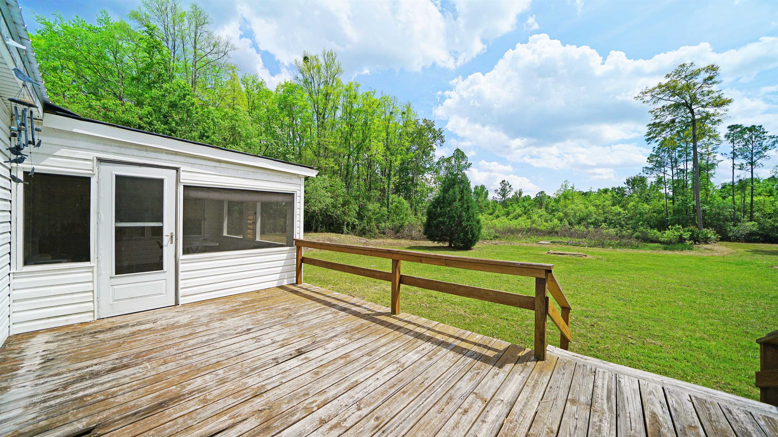 117 Jack Road Palatka, FL 32177 - Photo 26 of 34 a view of a terrace with wooden floor and fence