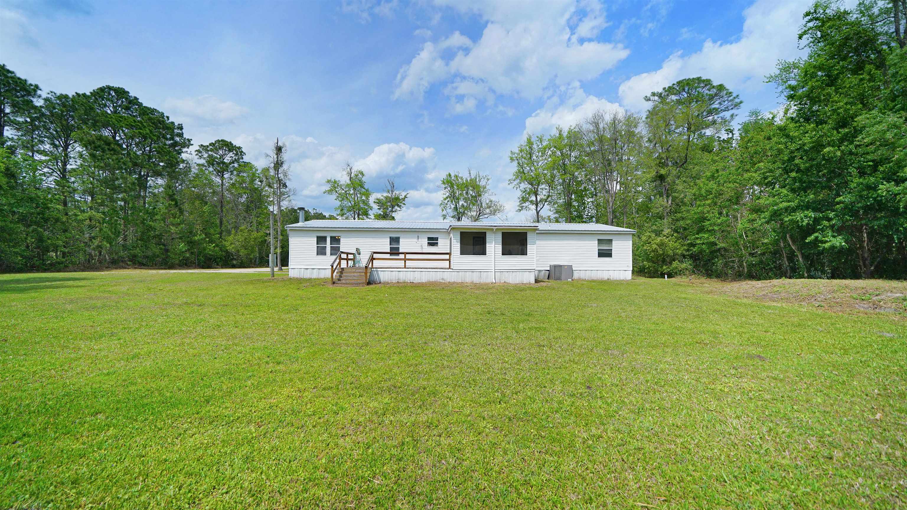 117 Jack Road Palatka, FL 32177 - Photo 29 of 34 a view of a house with a backyard