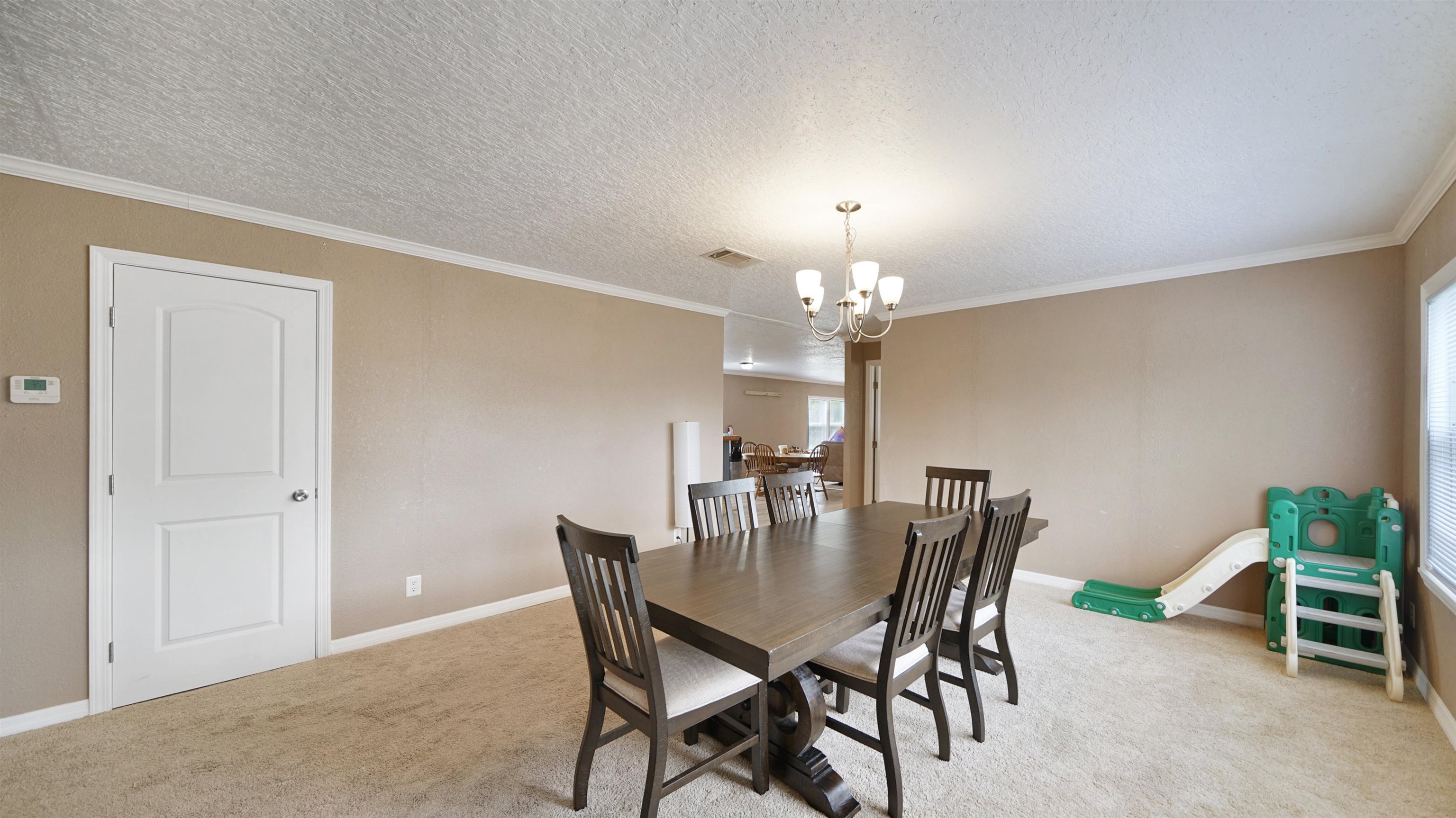 117 Jack Road Palatka, FL 32177 - Photo 4 of 34 a view of a dining room with furniture and chandelier