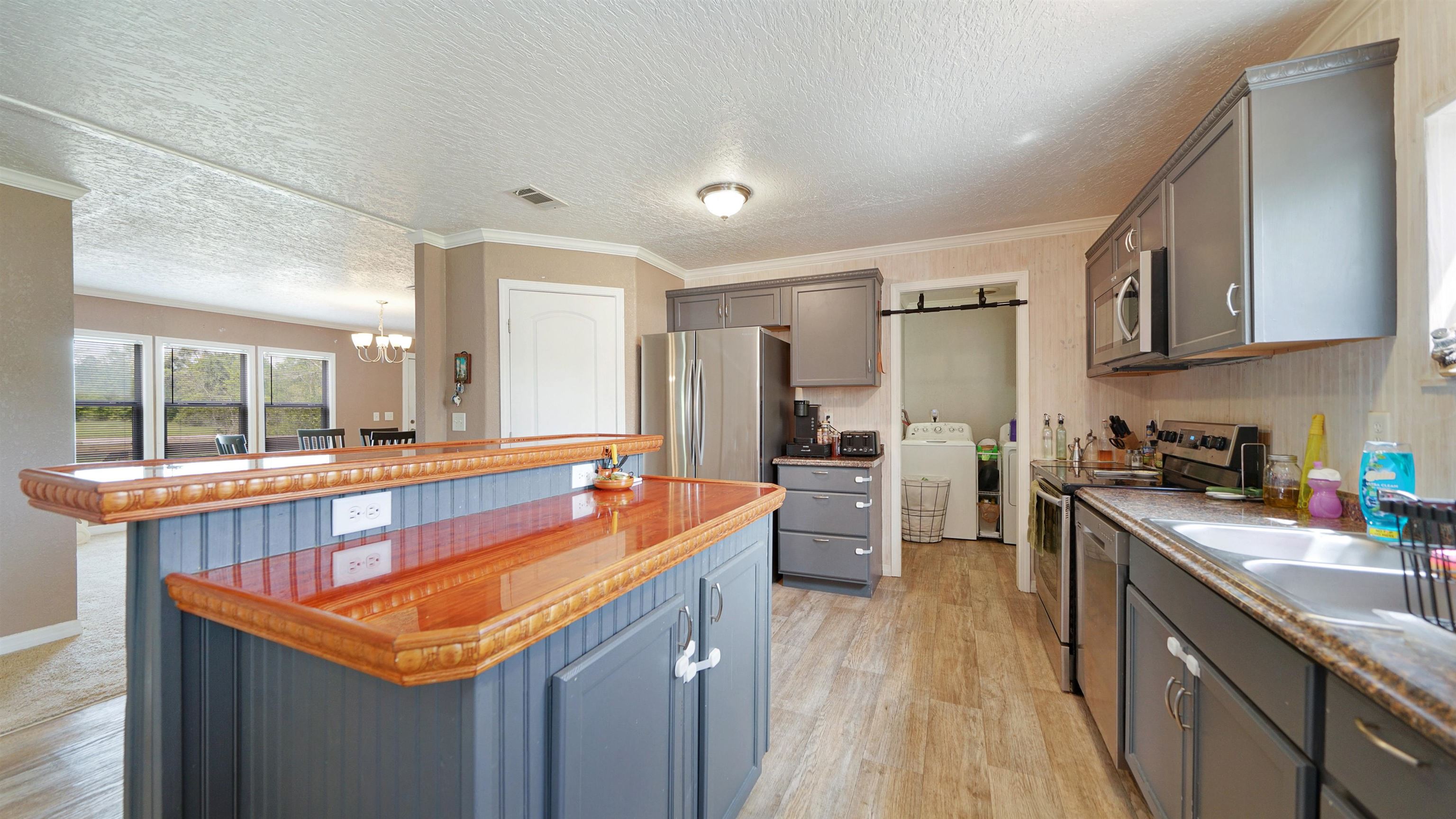 117 Jack Road Palatka, FL 32177 - Photo 8 of 34 a kitchen with stainless steel appliances granite countertop sink stove top oven and refrigerator