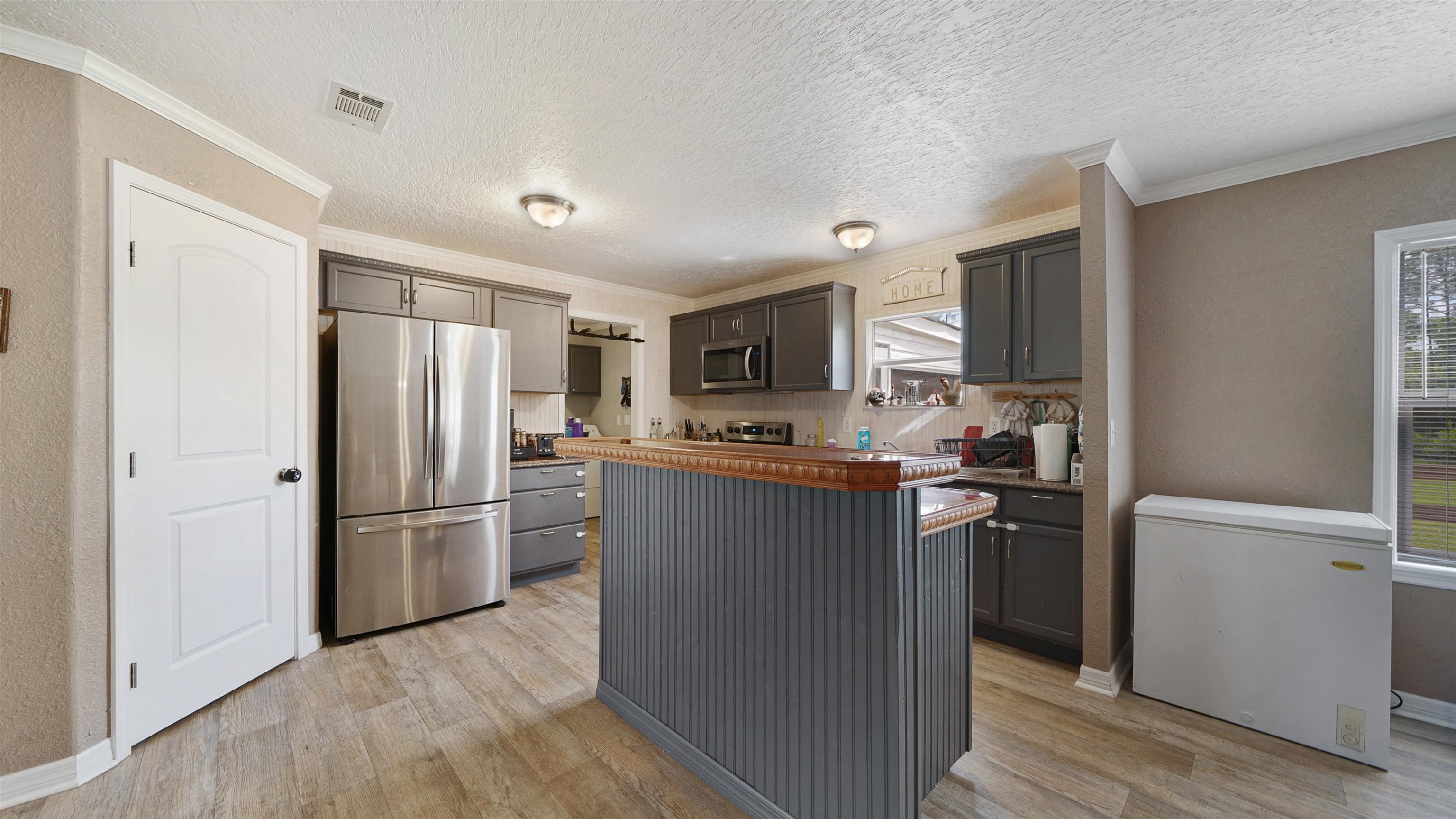 117 Jack Road Palatka, FL 32177 - Photo 9 of 34 a kitchen with stainless steel appliances granite countertop a refrigerator stove and microwave