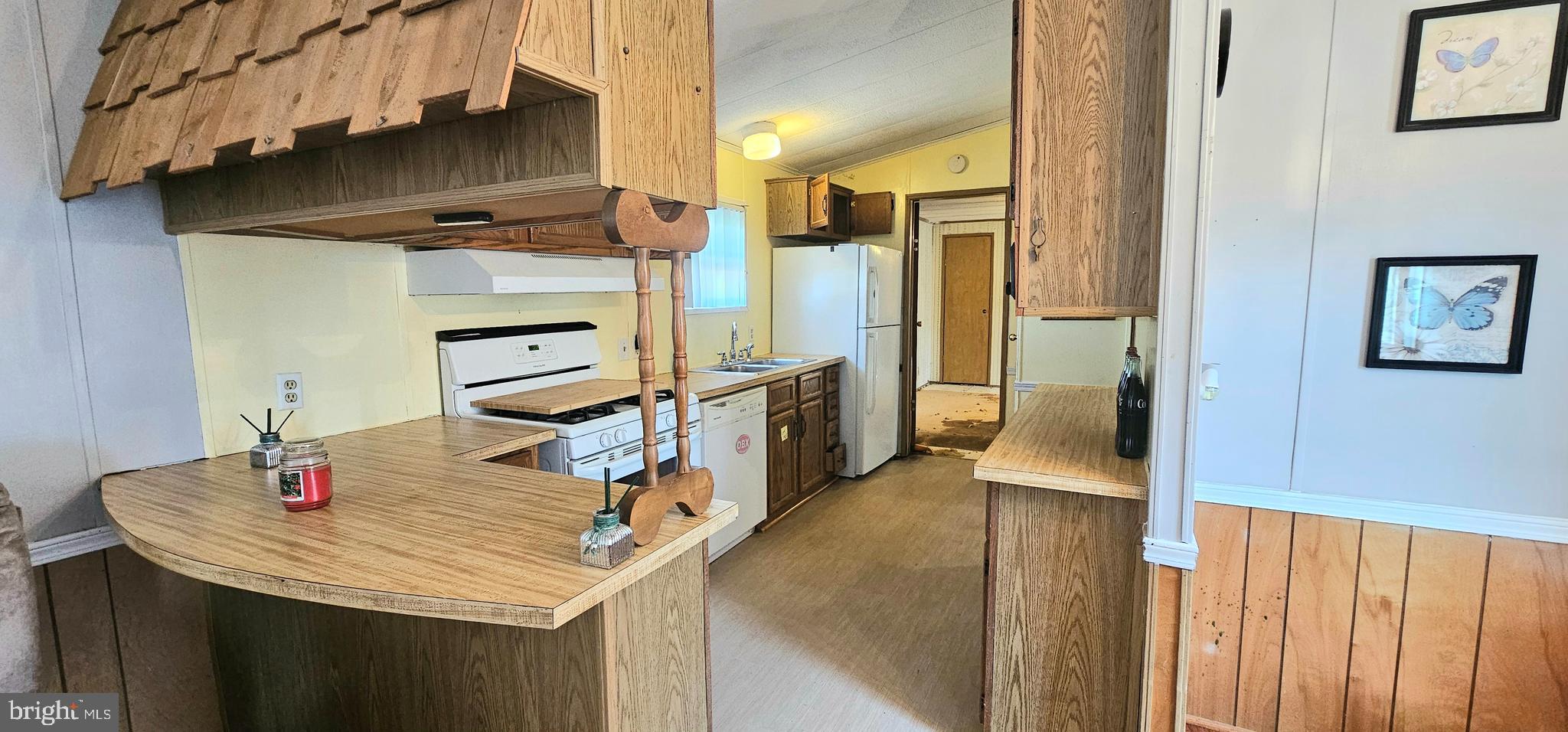 10505 Cedarville Road, Unit 1019 Brandywine, MD 20613 - Photo 4 of 15 a kitchen with stainless steel appliances granite countertop a sink refrigerator and stove