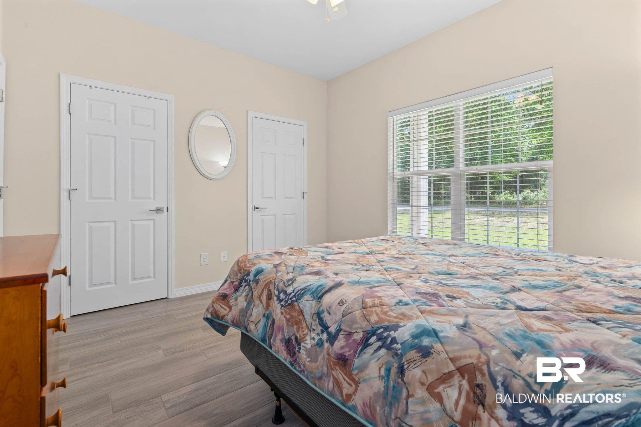 13751 Fish River Acres Circle Foley, AL 36535 - Photo 17 of 26 Bedroom featuring light wood-finish flooring, neutral wall paint, and white trim