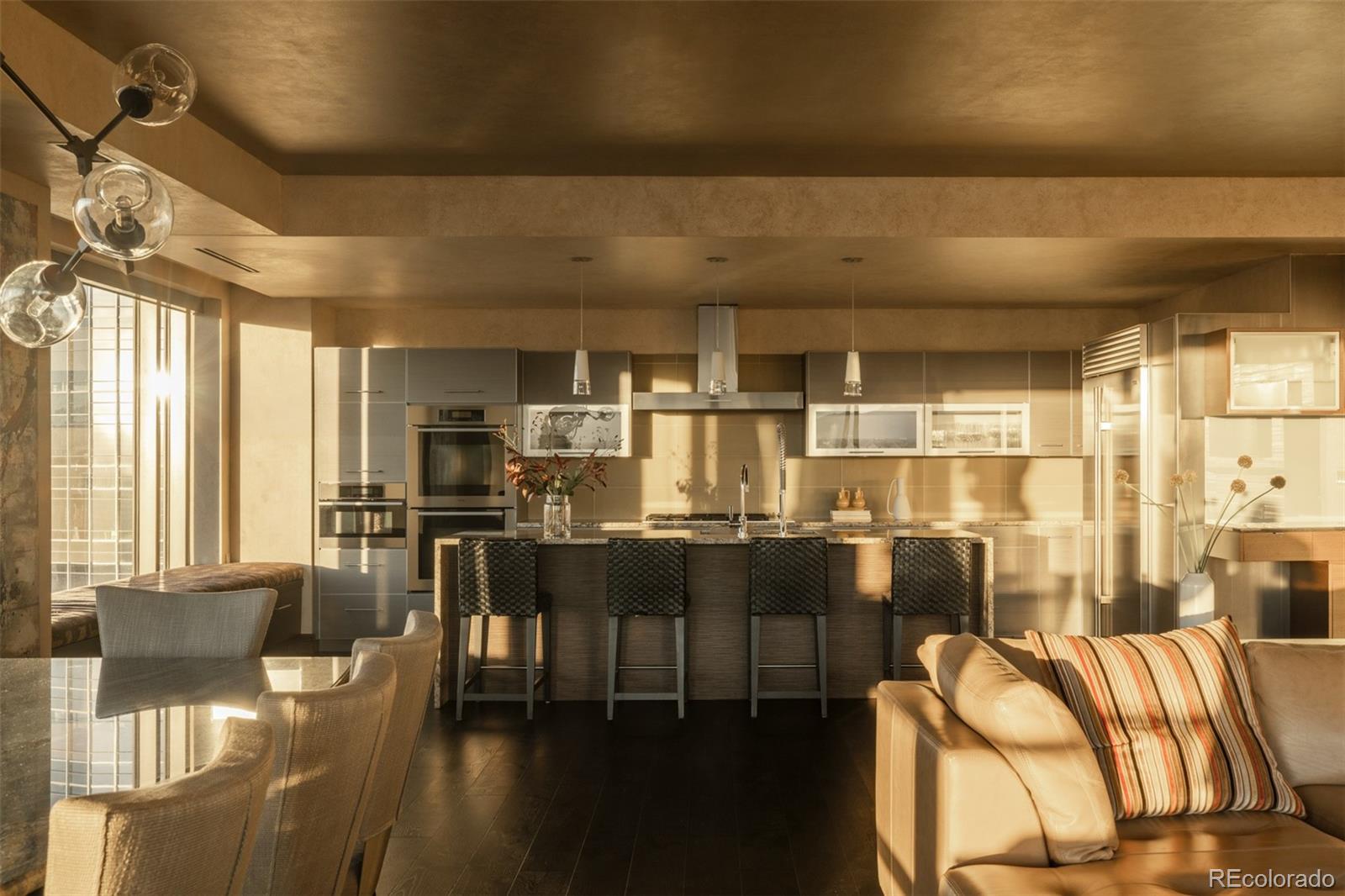 1133 14th Street, Unit 2900 Denver, CO 80202 - Photo 11 of 48 a kitchen with stainless steel appliances wooden floor and large windows
